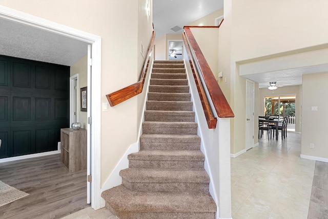 4432 La Paloma Rd NW, Albuquerque, NM 87120 - stairway featuring baseboards and a ceiling fan