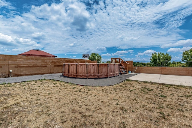 1191 Carrizo St NW, Los Lunas, NM 87031 - fenced backyard featuring a patio