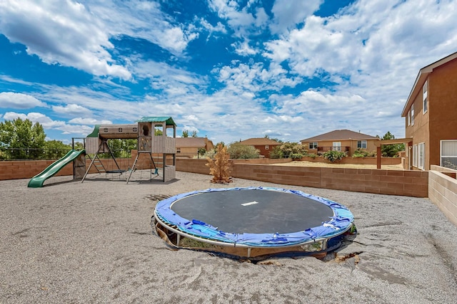 1191 Carrizo St NW, Los Lunas, NM 87031 - fenced backyard featuring a trampoline