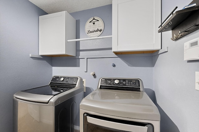 1191 Carrizo St NW, Los Lunas, NM 87031 - washroom with cabinet space and independent washer and dryer