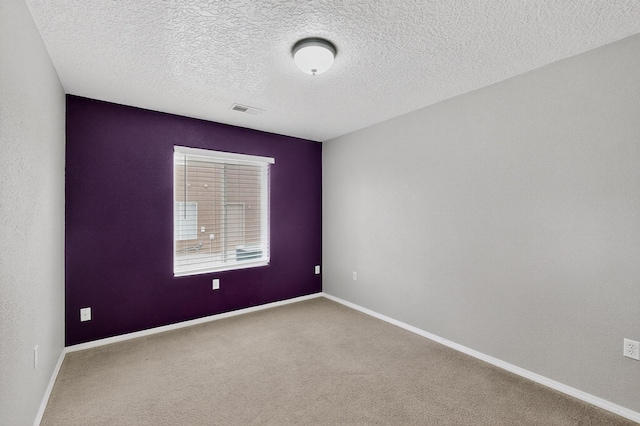 1191 Carrizo St NW, Los Lunas, NM 87031 - carpeted empty room with baseboards and a textured ceiling