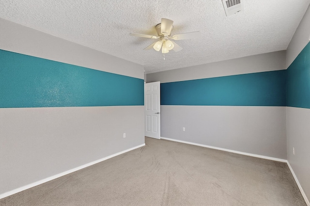 1191 Carrizo St NW, Los Lunas, NM 87031 - empty room featuring a ceiling fan, carpet floors, and a textured ceiling