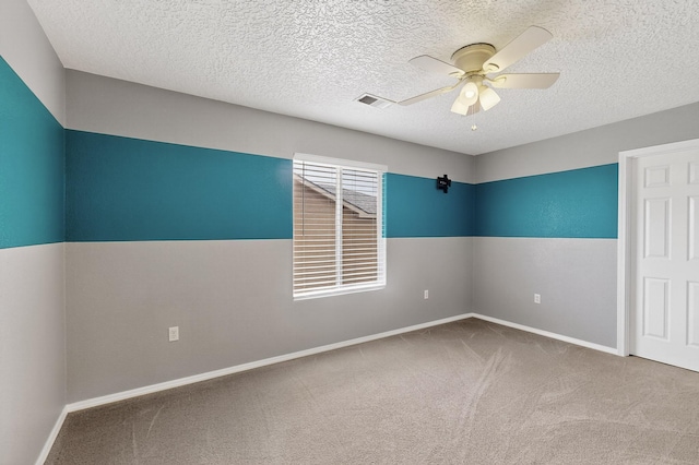 1191 Carrizo St NW, Los Lunas, NM 87031 - carpeted empty room with a ceiling fan and a textured ceiling