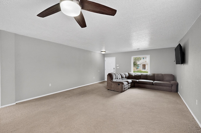 1191 Carrizo St NW, Los Lunas, NM 87031 - carpeted living area with a ceiling fan and a textured ceiling