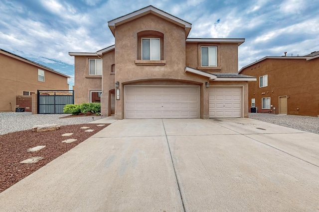 1191 Carrizo St NW, Los Lunas, NM 87031 - multi unit property featuring stucco siding, a garage, and concrete driveway