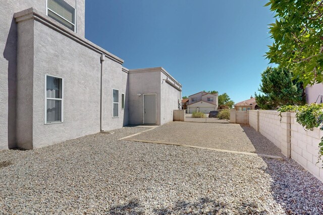 3546 Newcastle Dr SE, Rio Rancho, NM 87124 - fenced backyard featuring a patio