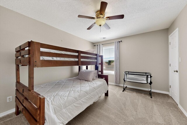3546 Newcastle Dr SE, Rio Rancho, NM 87124 - carpeted bedroom with a textured ceiling and ceiling fan