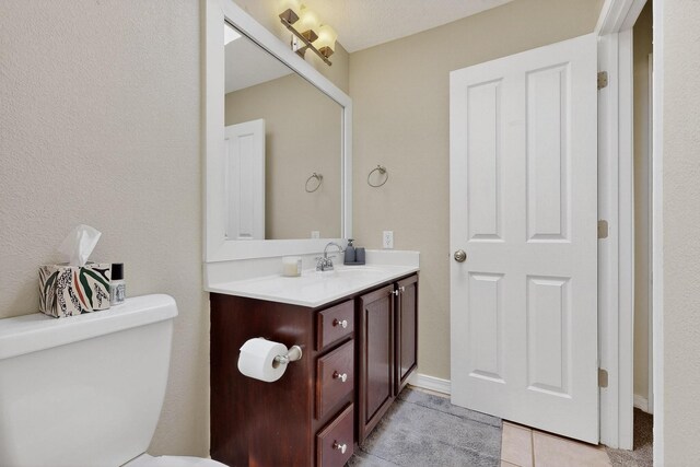 3546 Newcastle Dr SE, Rio Rancho, NM 87124 - half bath featuring vanity and tile patterned flooring