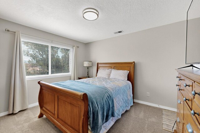 3546 Newcastle Dr SE, Rio Rancho, NM 87124 - bedroom with light colored carpet and a textured ceiling