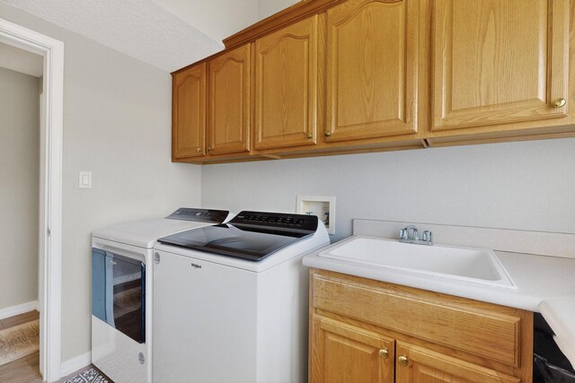 3546 Newcastle Dr SE, Rio Rancho, NM 87124 - washroom featuring washer and dryer and cabinet space