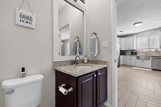 3546 Newcastle Dr SE, Rio Rancho, NM 87124 - bathroom with vanity and a textured ceiling