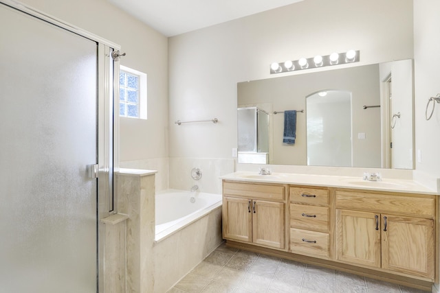 1852 Smarty Jones St SE, Albuquerque, NM 87123 - bathroom featuring a stall shower, double vanity, a bath, and tile patterned floors