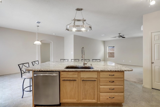 1852 Smarty Jones St SE, Albuquerque, NM 87123 - kitchen with dishwasher, a center island with sink, open floor plan, and light stone countertops