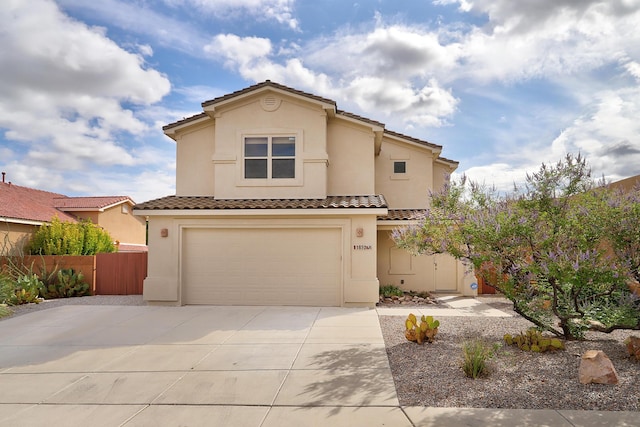 1852 Smarty Jones St SE, Albuquerque, NM 87123 - view of front of property with a tiled roof, an attached garage, concrete driveway, and stucco siding