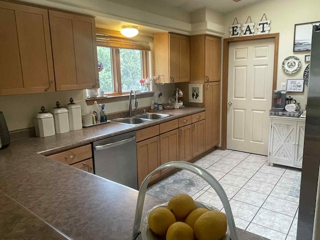 34358 US Highway 285, Ojo Caliente, NM 87549 - kitchen featuring stainless steel dishwasher, dark countertops, light tile patterned flooring, and brown cabinetry