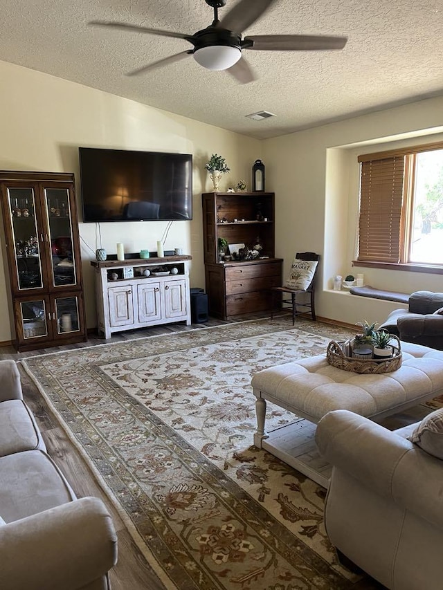 34358 US Highway 285, Ojo Caliente, NM 87549 - living area featuring a textured ceiling and ceiling fan