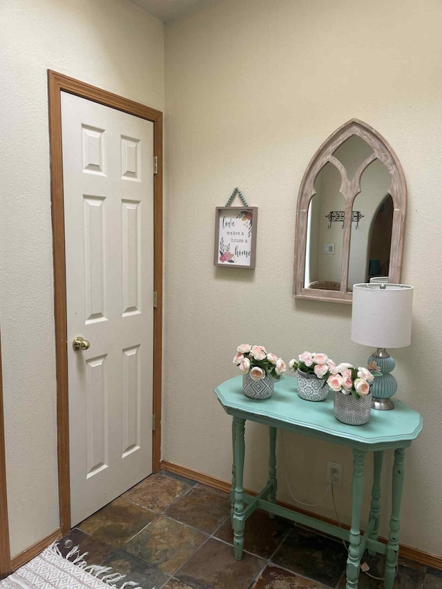 34358 US Highway 285, Ojo Caliente, NM 87549 - entryway featuring dark stone finish floors and baseboards