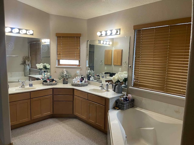 34358 US Highway 285, Ojo Caliente, NM 87549 - full bathroom with a bath, double vanity, and a textured ceiling