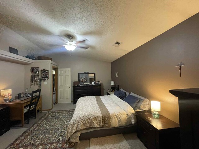 34358 US Highway 285, Ojo Caliente, NM 87549 - bedroom with lofted ceiling, a textured ceiling, ceiling fan, and an office area