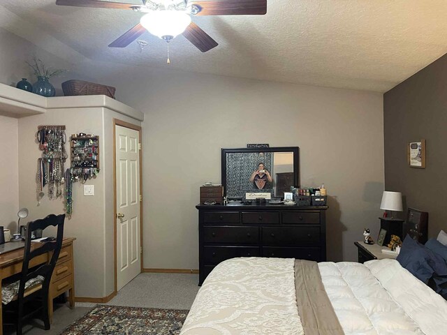 34358 US Highway 285, Ojo Caliente, NM 87549 - carpeted bedroom with a textured ceiling and a ceiling fan