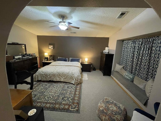 34358 US Highway 285, Ojo Caliente, NM 87549 - carpeted bedroom with a textured ceiling and ceiling fan