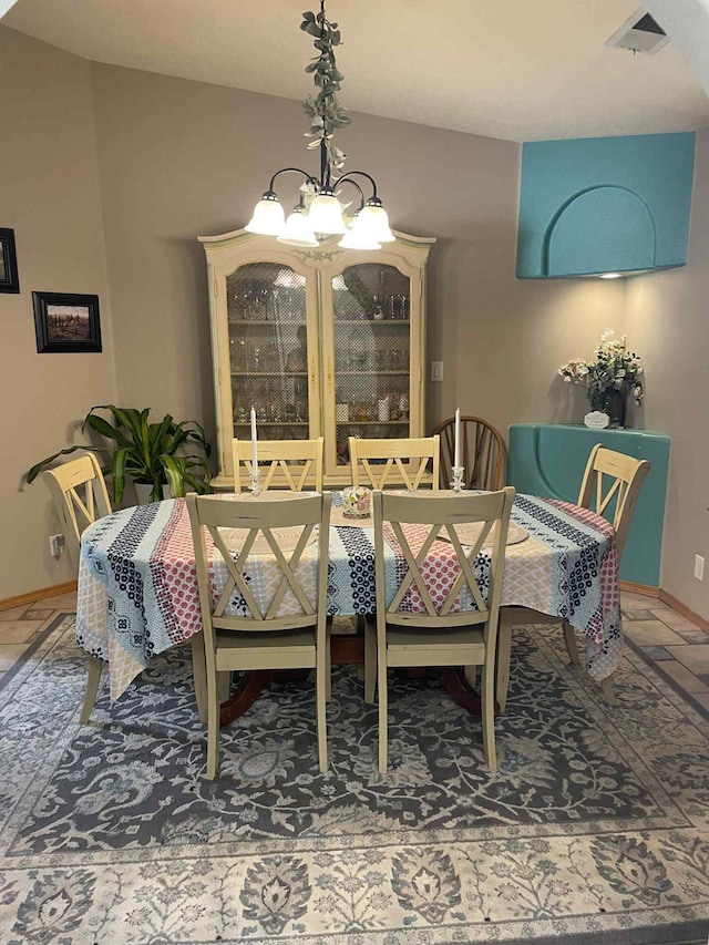 34358 US Highway 285, Ojo Caliente, NM 87549 - dining space featuring a chandelier and baseboards