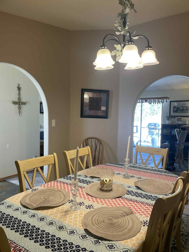 34358 US Highway 285, Ojo Caliente, NM 87549 - dining space featuring arched walkways and a chandelier