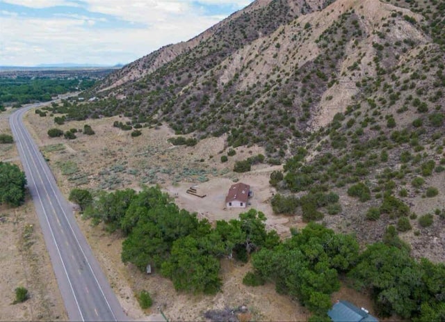 34358 US Highway 285, Ojo Caliente, NM 87549 - aerial view of property's location with a mountainous background and rural landscape
