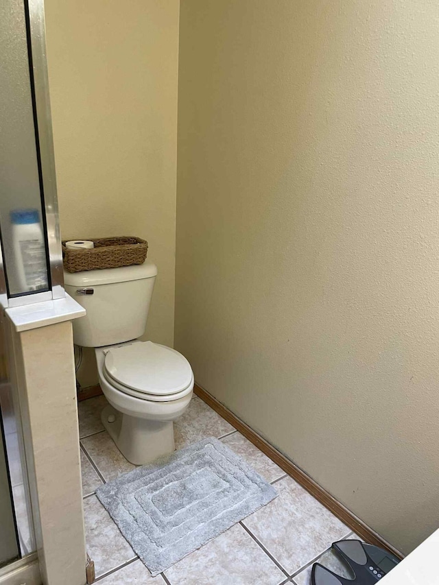 34358 US Highway 285, Ojo Caliente, NM 87549 - bathroom with toilet and tile patterned floors