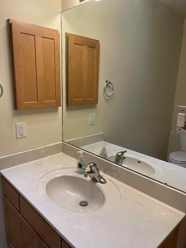 34358 US Highway 285, Ojo Caliente, NM 87549 - bathroom with vanity and toilet