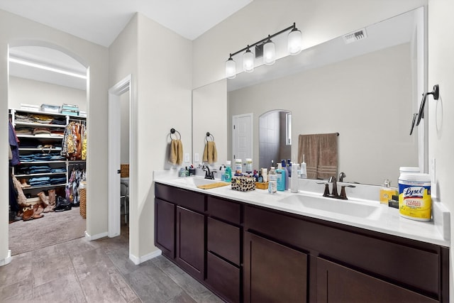 4276 Crowned Eagle Loop NE, Rio Rancho, NM 87144 - bathroom featuring double vanity and a spacious closet