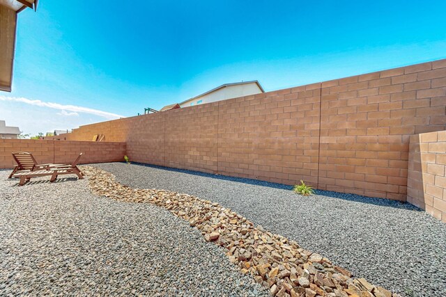 4276 Crowned Eagle Loop NE, Rio Rancho, NM 87144 - fenced backyard featuring a patio area
