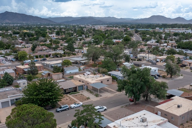 1308 Boatright Dr NE, Albuquerque, NM 87112 - aerial perspective of suburban area featuring a mountainous background