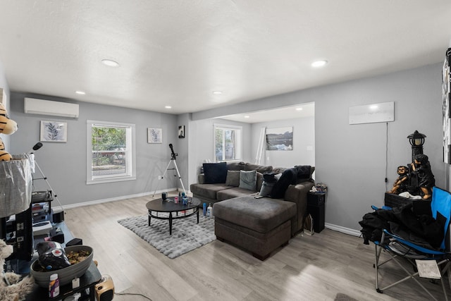 2024 Hinkle St SE, Albuquerque, NM 87102 - living area with a wall unit AC, light wood-type flooring, plenty of natural light, and recessed lighting