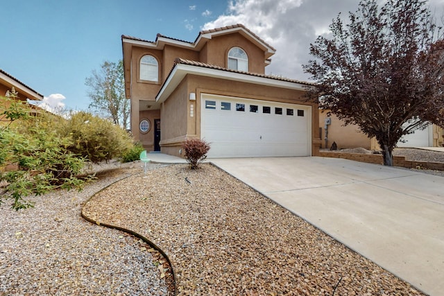 5508 Carefree Ave NW, Albuquerque, NM 87120 - mediterranean / spanish house with stucco siding, concrete driveway, and a tile roof