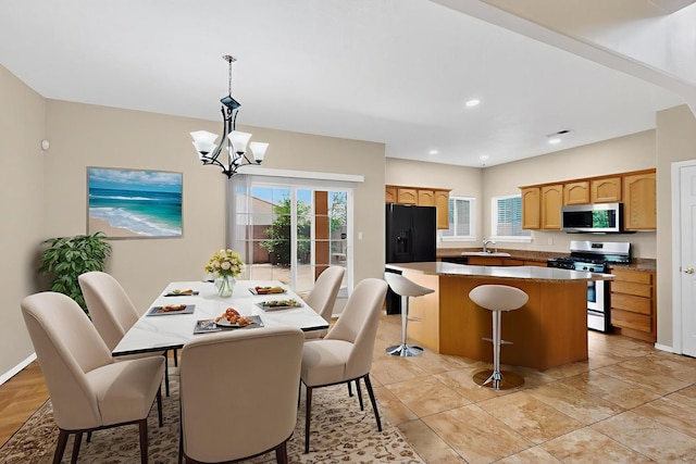 5508 Carefree Ave NW, Albuquerque, NM 87120 - dining space with a chandelier, plenty of natural light, and recessed lighting