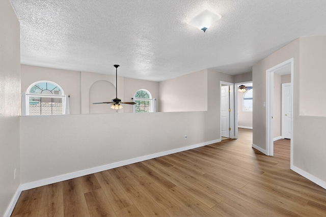 5508 Carefree Ave NW, Albuquerque, NM 87120 - empty room featuring ceiling fan, a textured ceiling, and wood finished floors