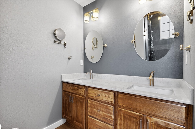 5508 Carefree Ave NW, Albuquerque, NM 87120 - bathroom with double vanity and baseboards