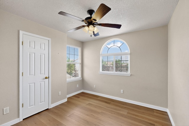 5508 Carefree Ave NW, Albuquerque, NM 87120 - empty room featuring wood finished floors, ceiling fan, and a textured ceiling