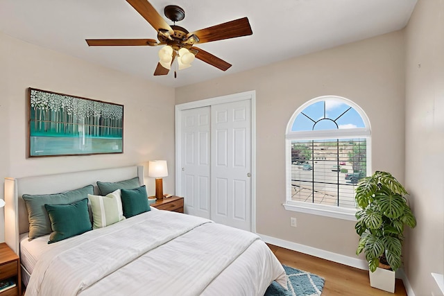 5508 Carefree Ave NW, Albuquerque, NM 87120 - bedroom with wood finished floors, a closet, and a ceiling fan