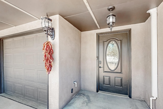 12208 Phoenix Ave NE, Albuquerque, NM 87112 - doorway to property featuring stucco siding and a garage