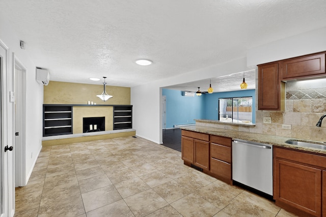 12208 Phoenix Ave NE, Albuquerque, NM 87112 - kitchen with dishwasher, a textured ceiling, open floor plan, decorative light fixtures, and light stone counters