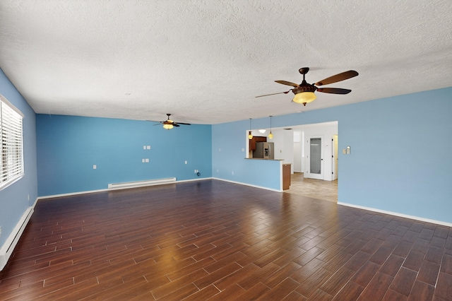 12208 Phoenix Ave NE, Albuquerque, NM 87112 - unfurnished living room featuring ceiling fan, wood finished floors, a baseboard radiator, and a textured ceiling