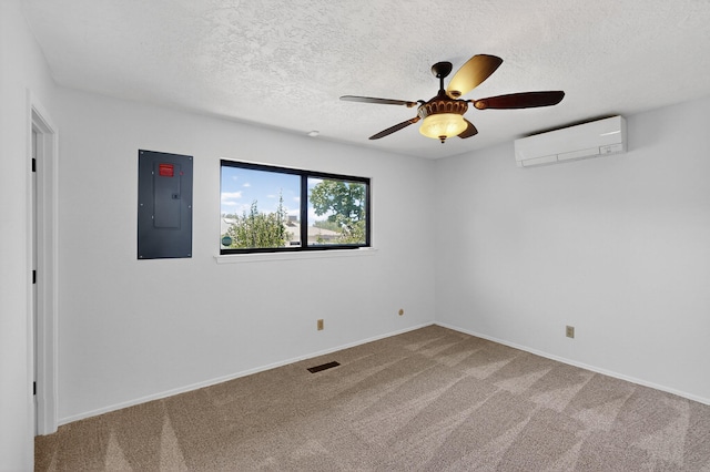 12208 Phoenix Ave NE, Albuquerque, NM 87112 - spare room featuring a wall unit AC, electric panel, a ceiling fan, carpet, and a textured ceiling