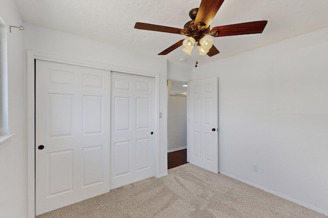 12208 Phoenix Ave NE, Albuquerque, NM 87112 - unfurnished bedroom featuring a closet, carpet floors, and a ceiling fan