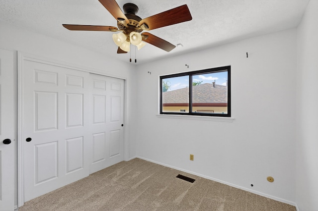 12208 Phoenix Ave NE, Albuquerque, NM 87112 - unfurnished bedroom with carpet flooring, a closet, and ceiling fan
