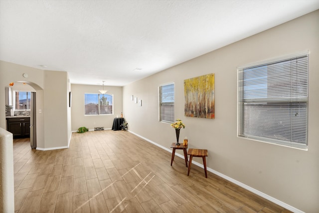 5478 Salem Ct NE, Rio Rancho, NM 87144 - unfurnished room featuring light wood-type flooring and arched walkways