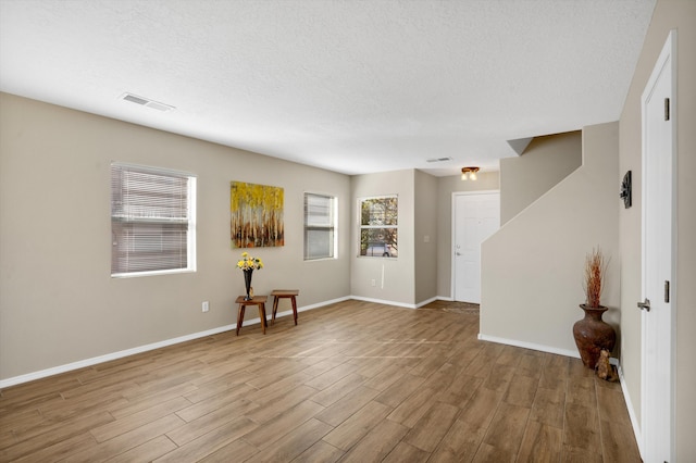 5478 Salem Ct NE, Rio Rancho, NM 87144 - spare room with wood finished floors and a textured ceiling