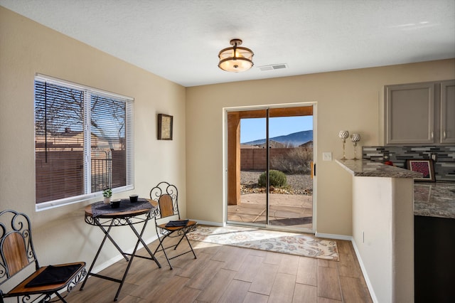 5478 Salem Ct NE, Rio Rancho, NM 87144 - doorway with wood finished floors and baseboards