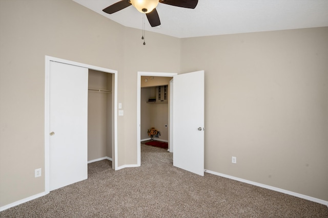 5478 Salem Ct NE, Rio Rancho, NM 87144 - unfurnished bedroom with carpet, vaulted ceiling, a closet, and a ceiling fan